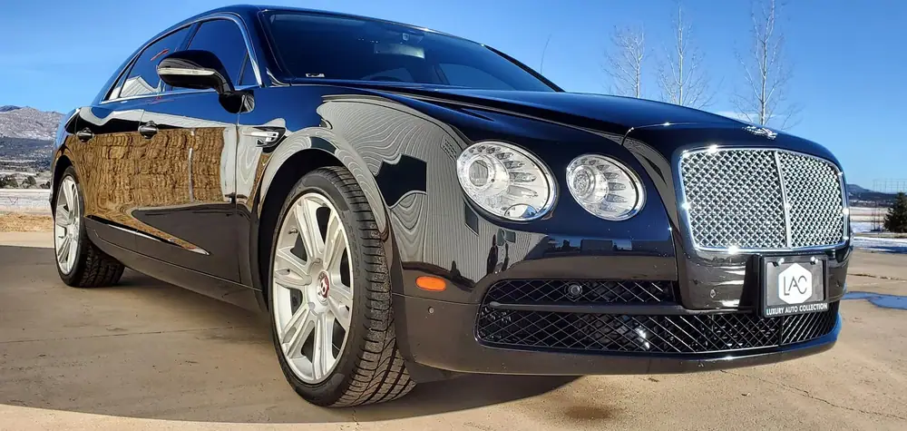 Black Bentley sedan with a mirror finish