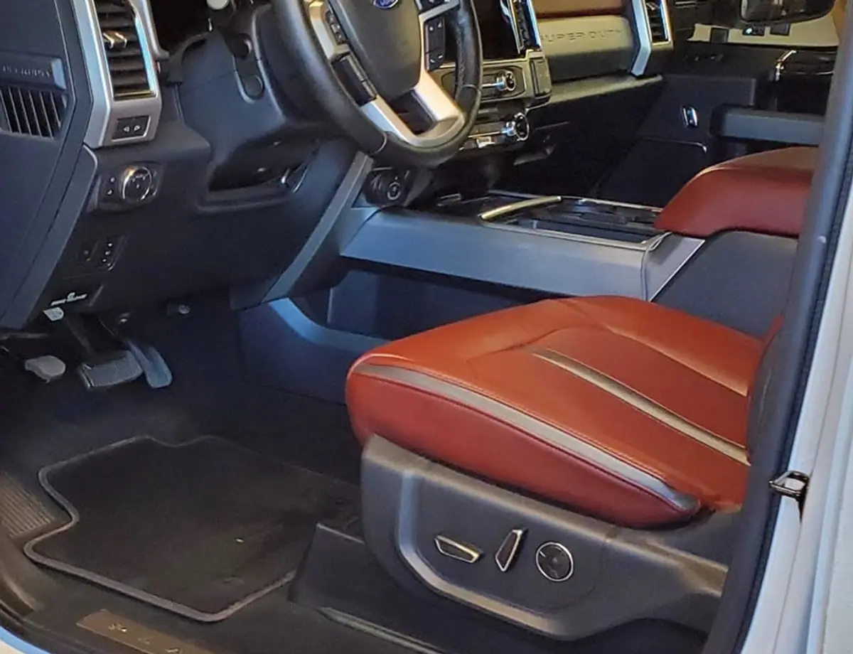 Clean Ford F-150 driver floor and mats after an interior detail
