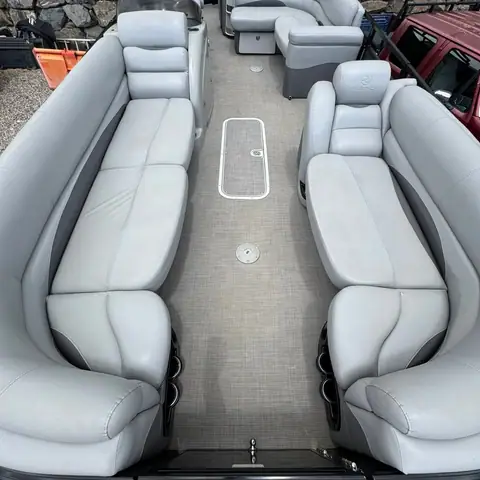 Clean light-gray vinyl seating and deck on a pontoon boat
